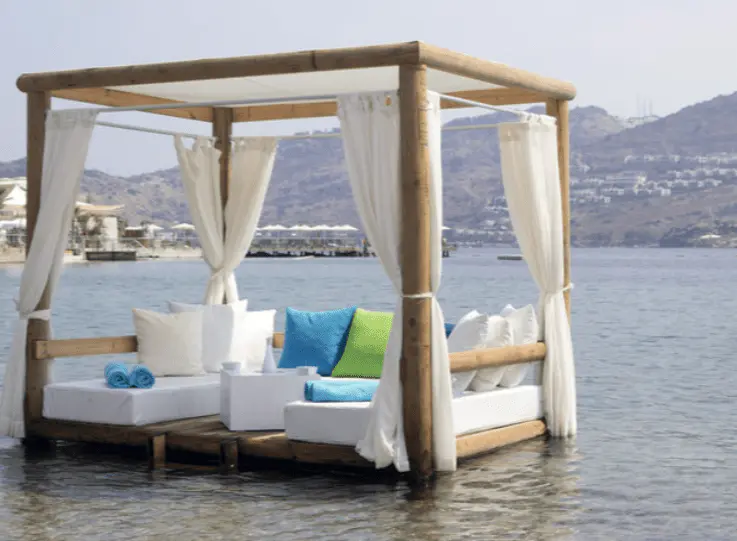 Pergola on the beach with outdoor curtains, durable fabric, privacy adjustment, sun protection, stylish outdoor décor