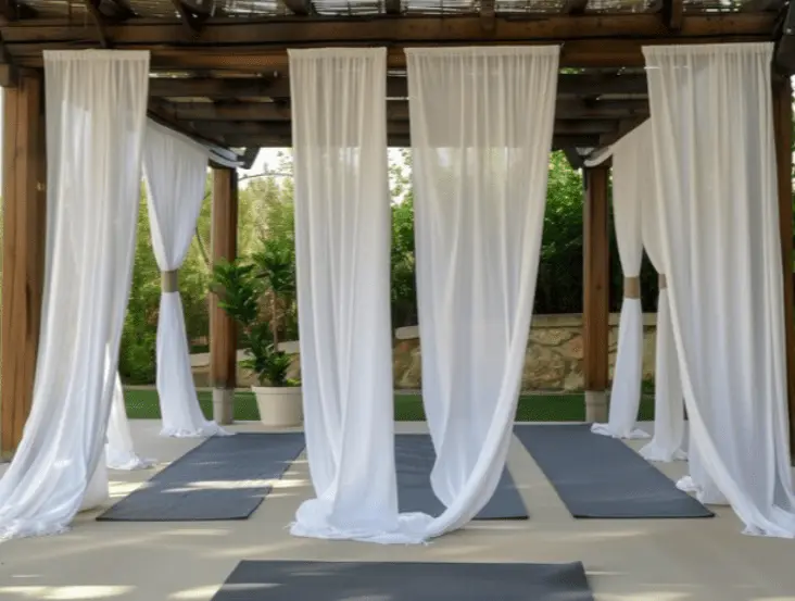 Pergola with outdoor curtains, durable fabric, privacy adjustment, sun protection