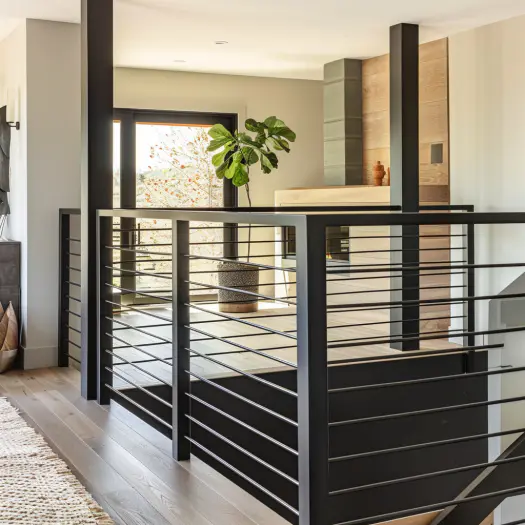 minimalist black metal railings, modern interior, staircase, pale walls, simple style..
