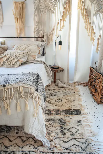 boho bedroom decor, layered rugs, textured bedding, macramé