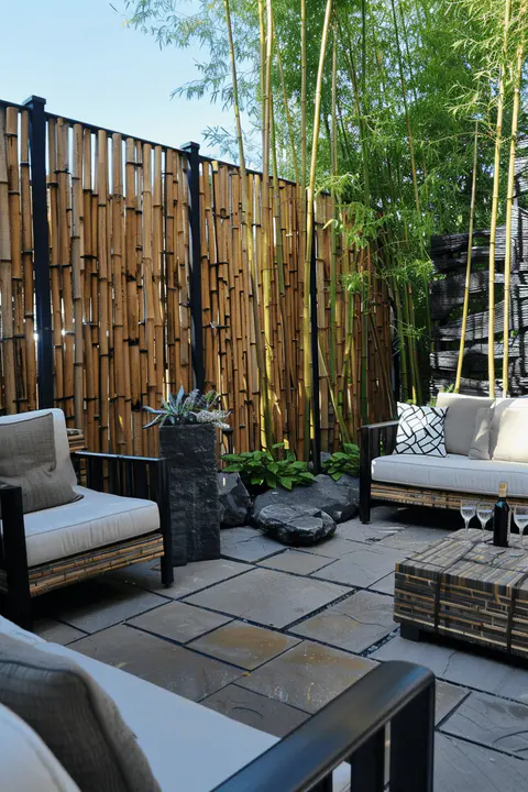 backyard bamboo privacy screen, minimalist patio, and stylish outdoor furniture