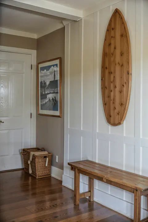 wall panel board and batten style with surfboard into the wall
